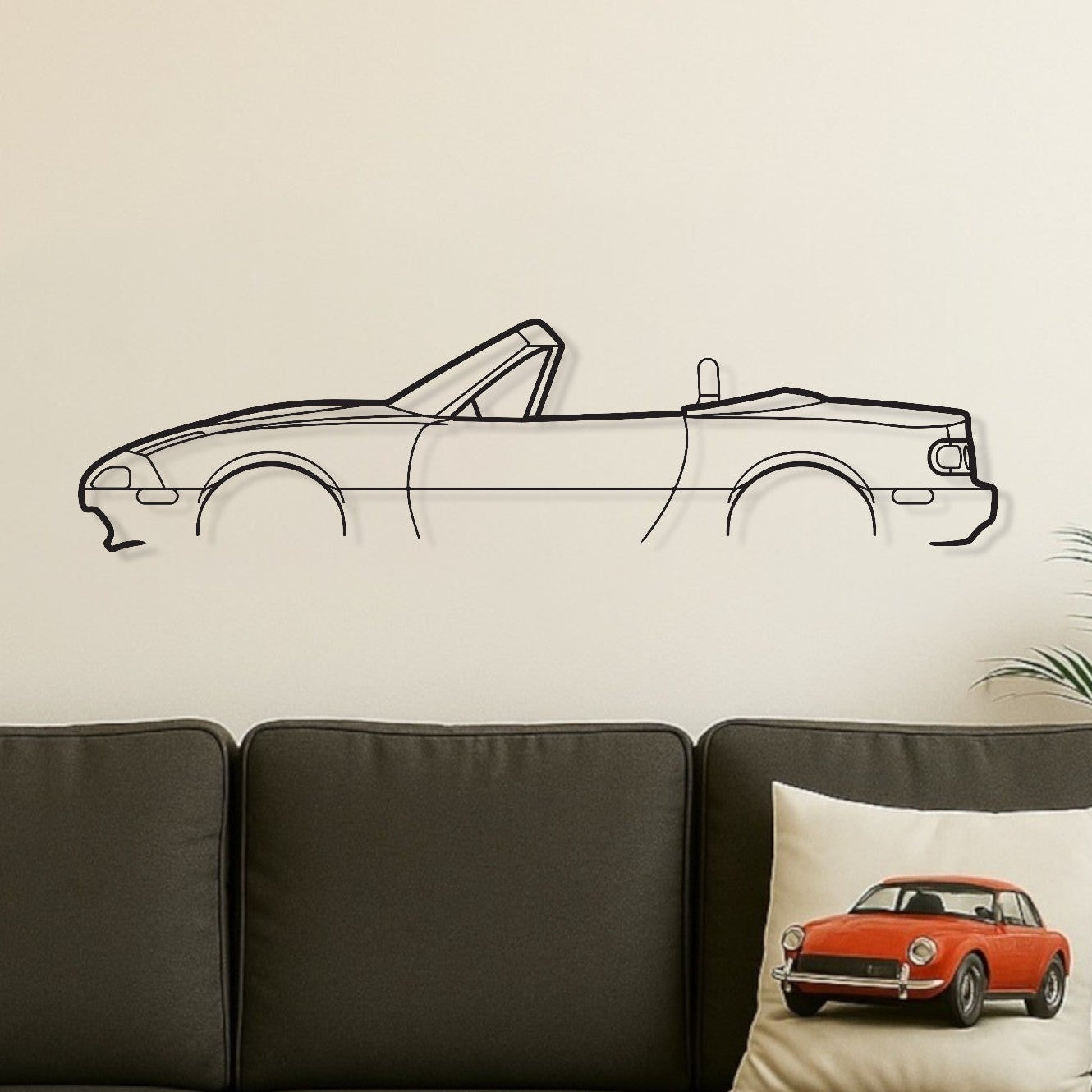 Living room with a gray sofa, wooden coffee table, and car-themed decor.