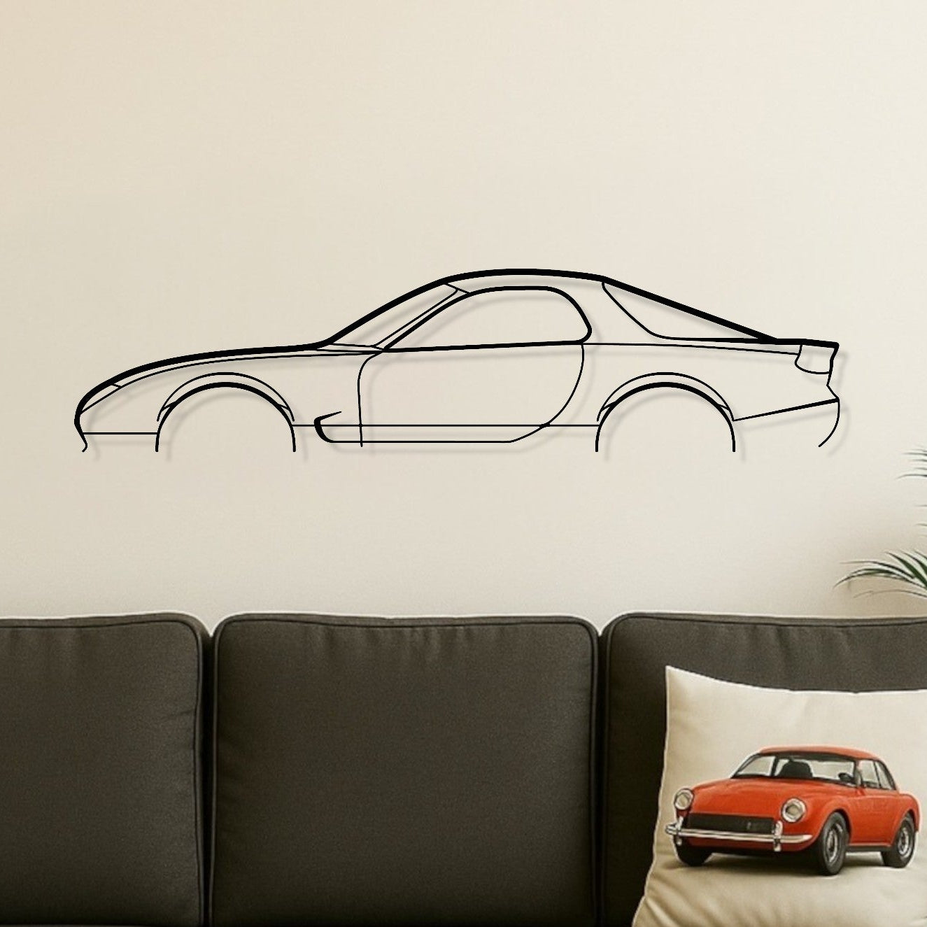 Living room with a gray sofa, wooden coffee table, and car-themed decor.