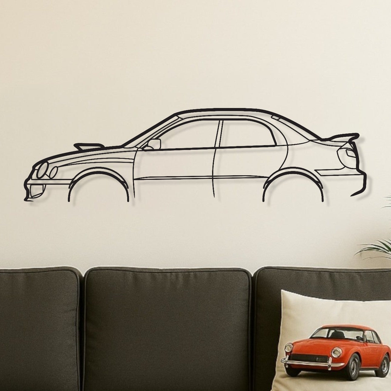 Living room with a gray sofa, wooden coffee table, and car-themed decor.