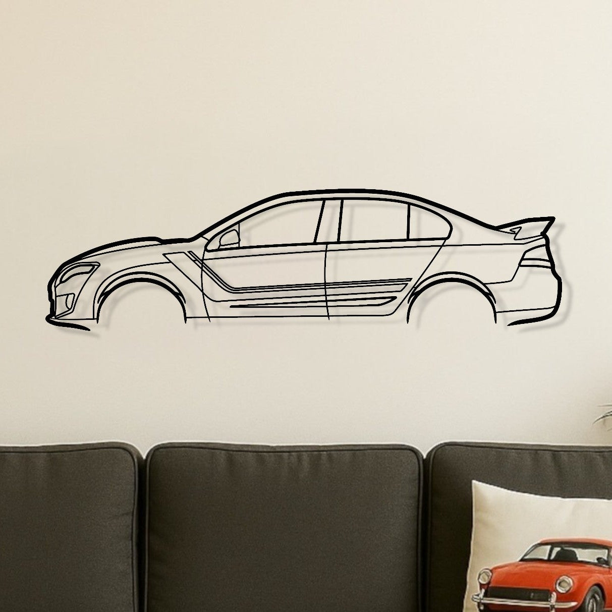 Living room with a gray sofa, wooden coffee table, and car-themed decor.