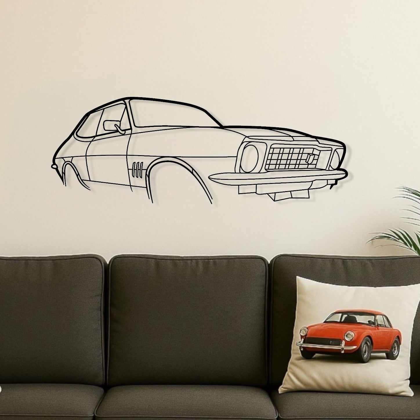 Living room with a gray sofa, wooden coffee table, and car-themed decor.