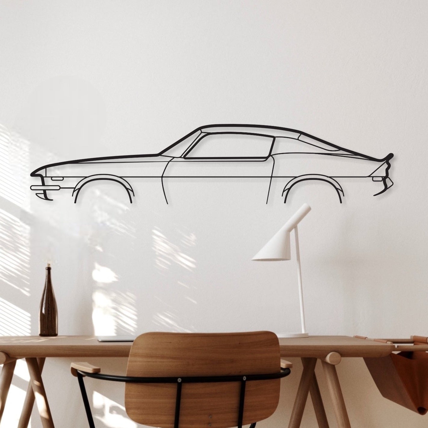 Chevrolet Camaro black metal silhouette hanging in an office.