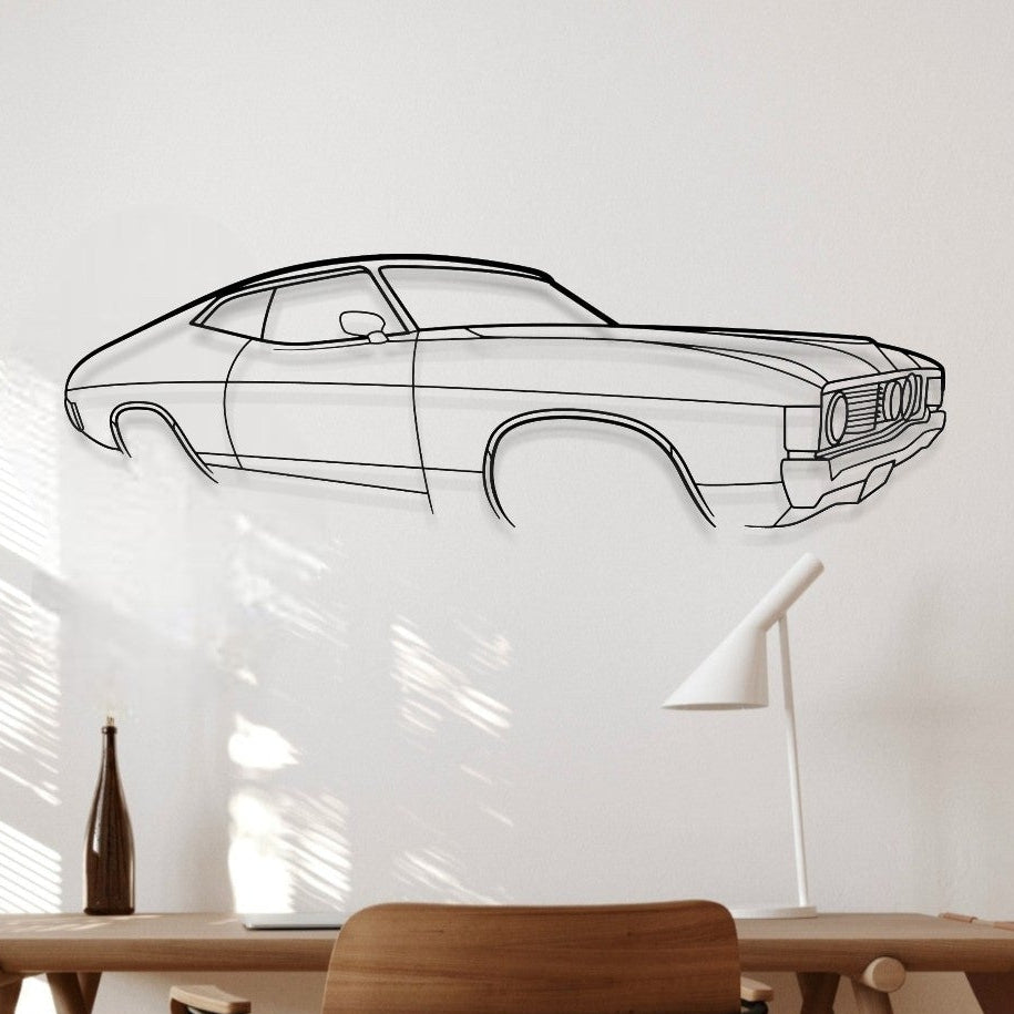 Line drawing of a car on a white wall above a wooden table.