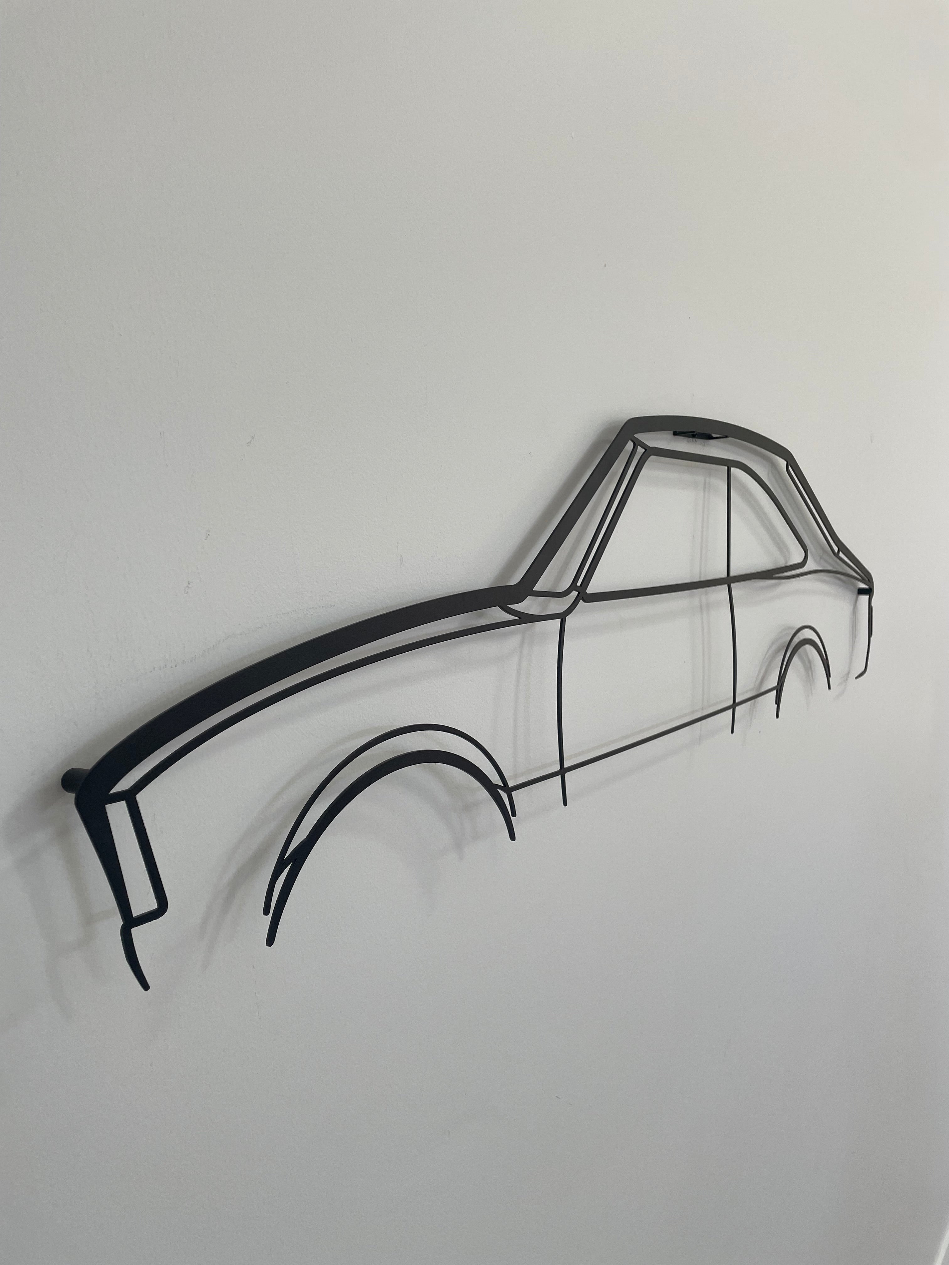 Large Mazda RX2 Coupe metal wall art side-on against a white wall.