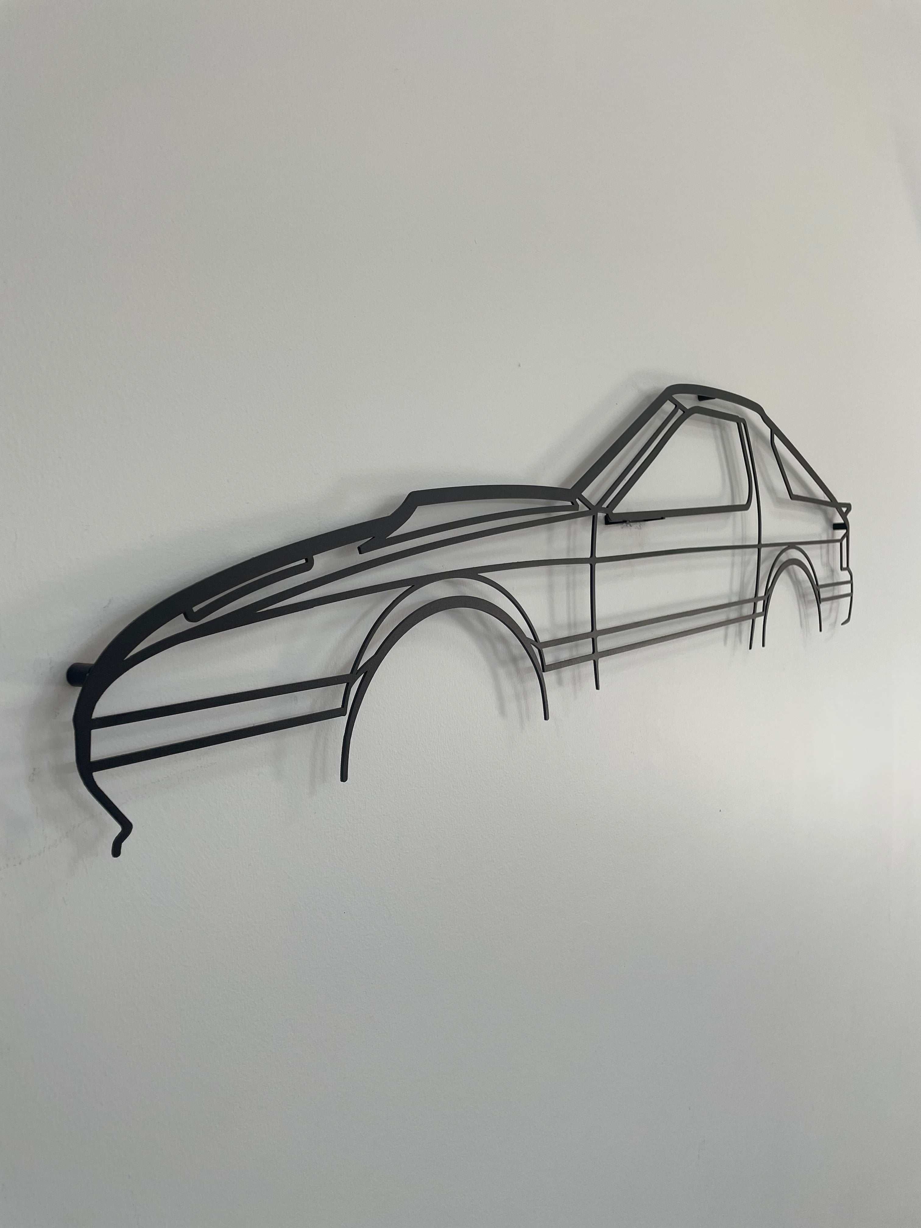 Mazda RX7 Series 4 auto metal art side-on against a white wall.