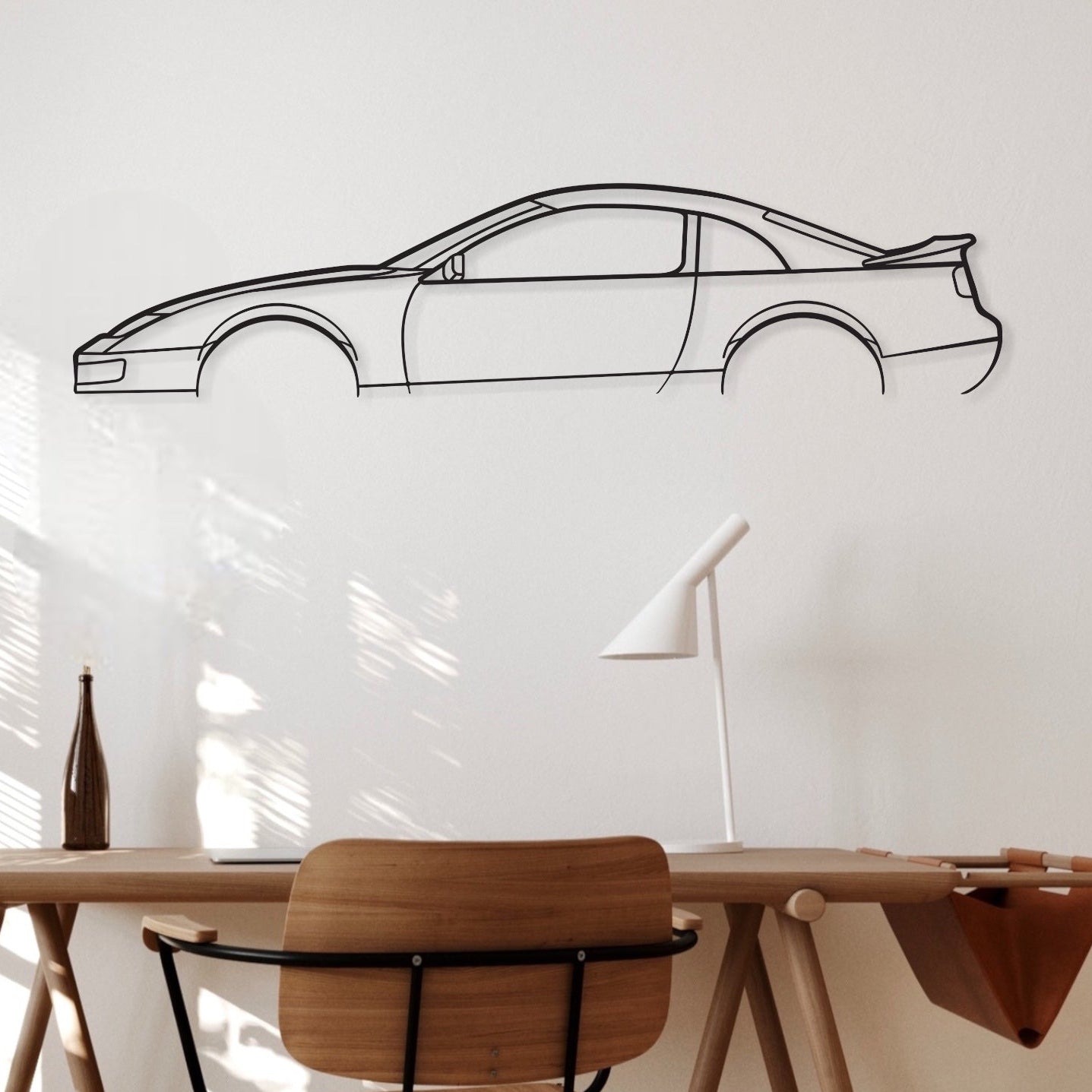 Nissan 300Z car decor hanging above an office desk.