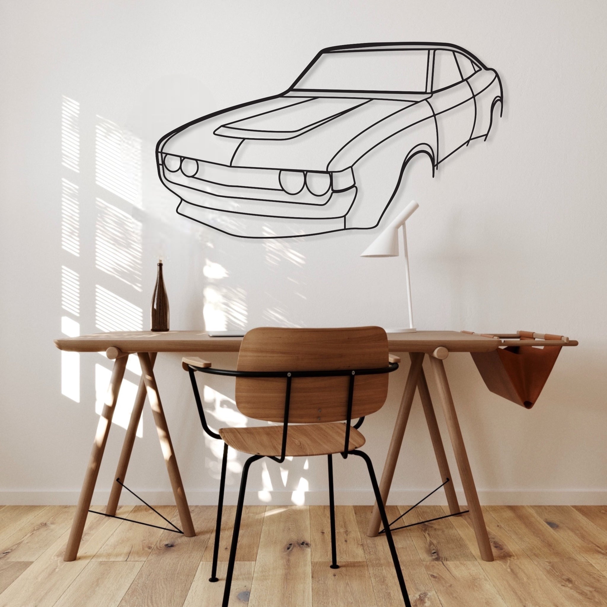 Toyota Celica RA28 Perspective car silhouette wall art hangs in an office.