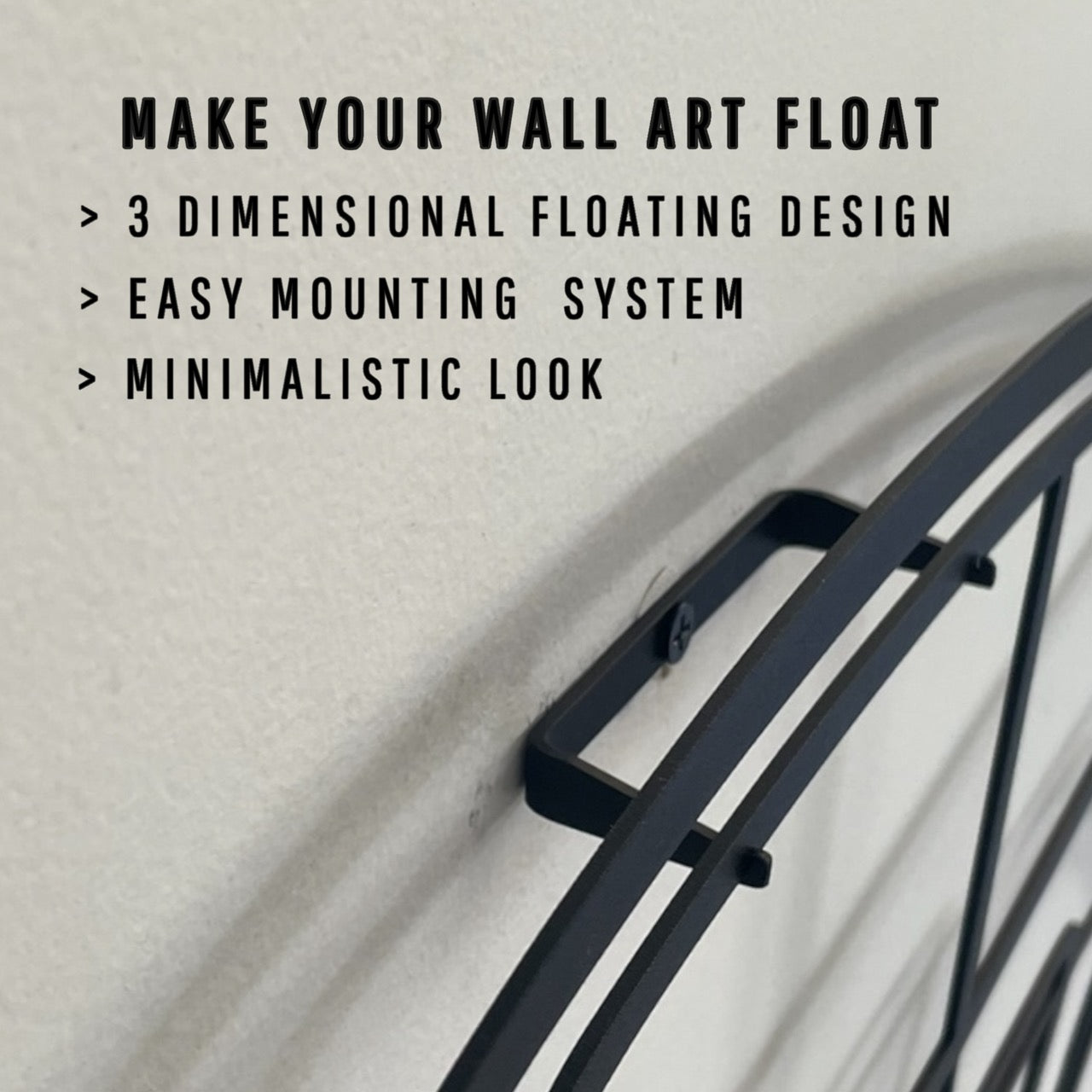 Black wall art mounting system with text on a textured beige background