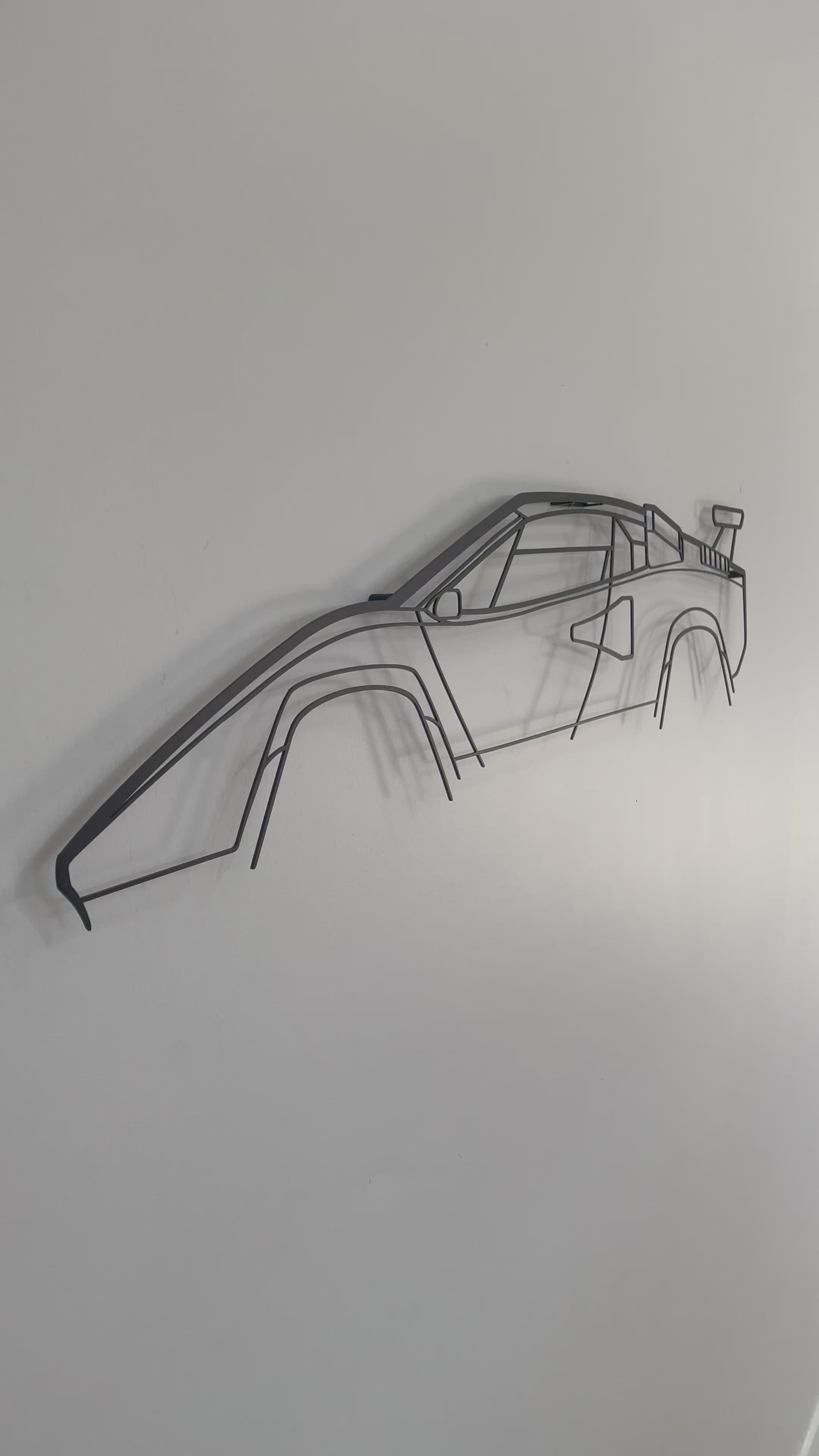 Lamborgini Countach side on and close up of metal wall hanging