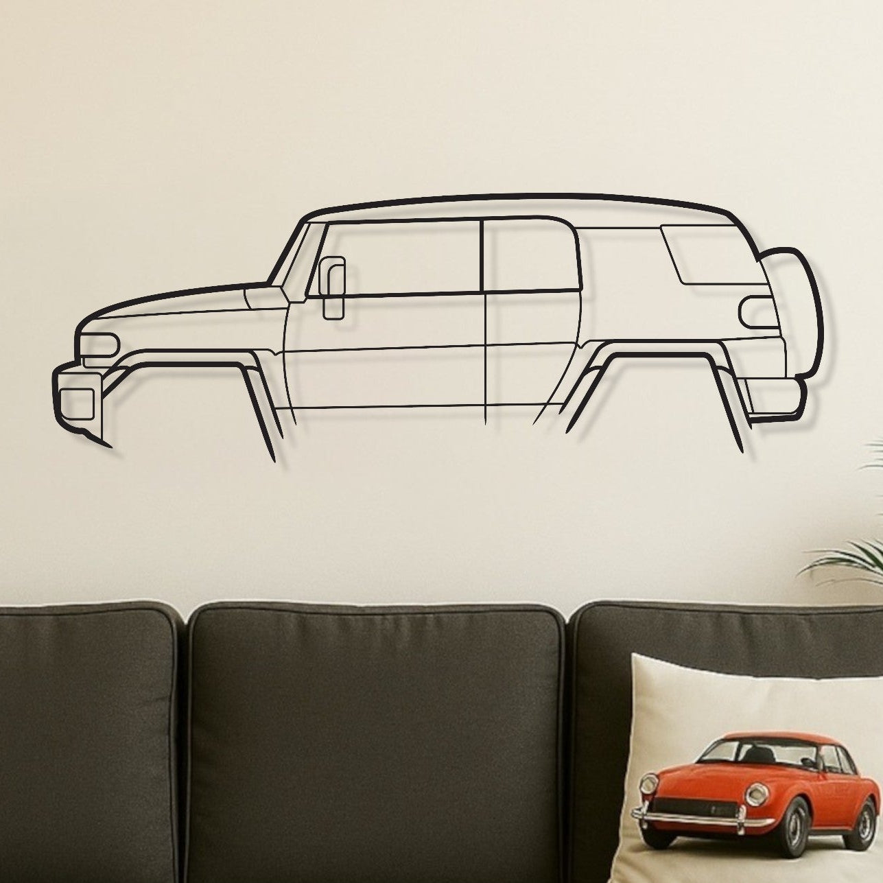 Living room with a gray sofa, wooden coffee table, and wall decal of a limousine.