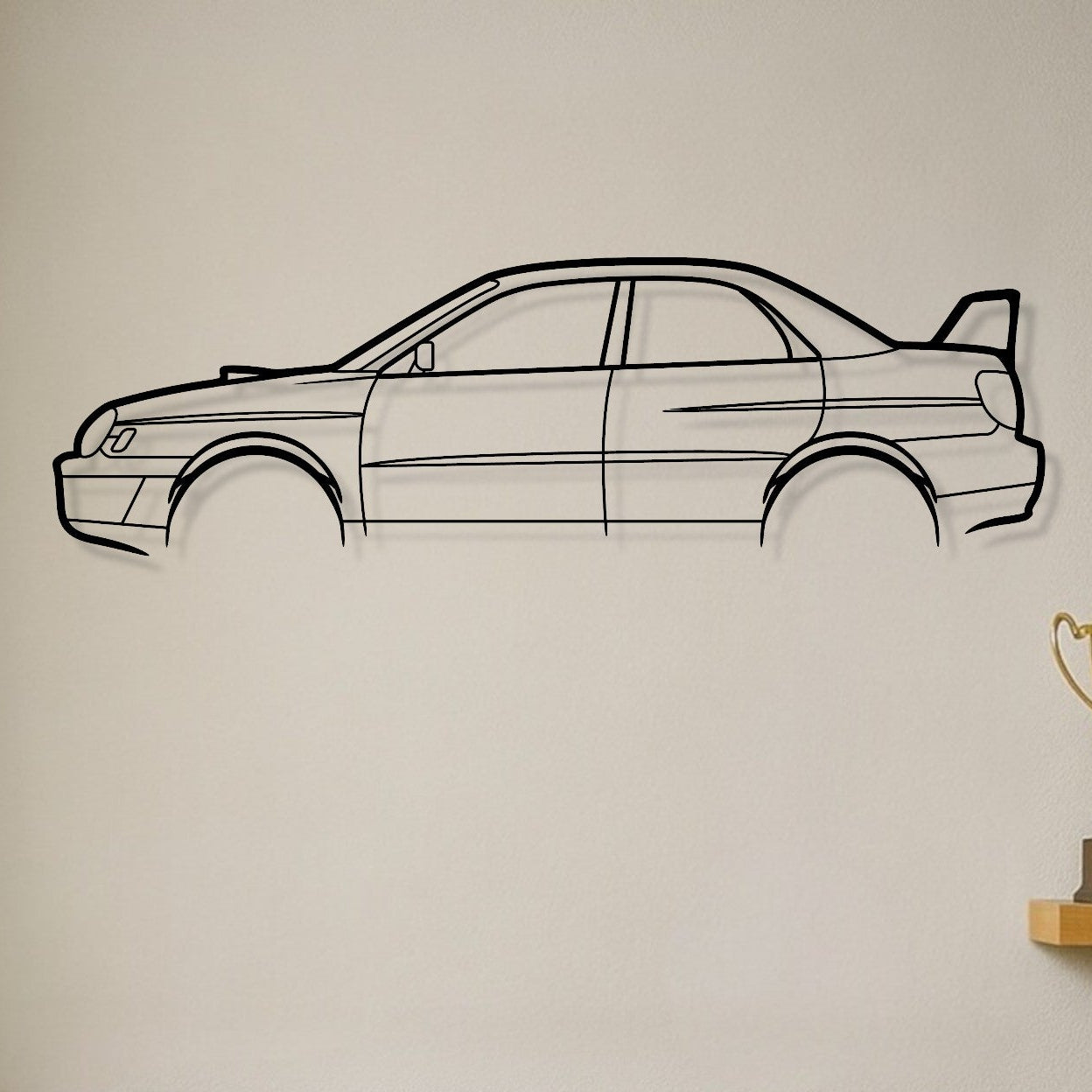 Brown leather sofa with decorative pillows, car wall decal, and trophies on a shelf.