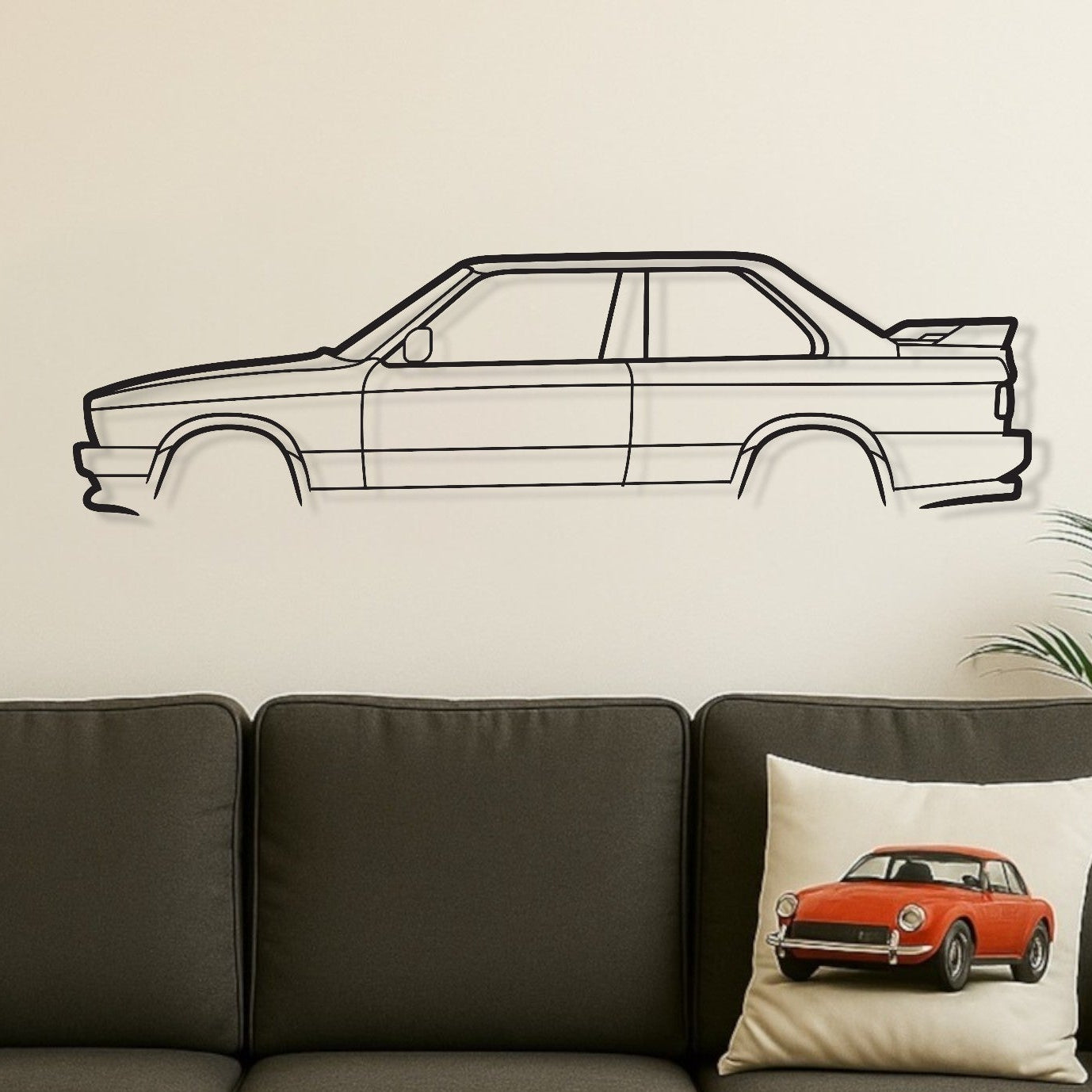 Living room with a gray sofa, wooden coffee table, and car-themed decor.