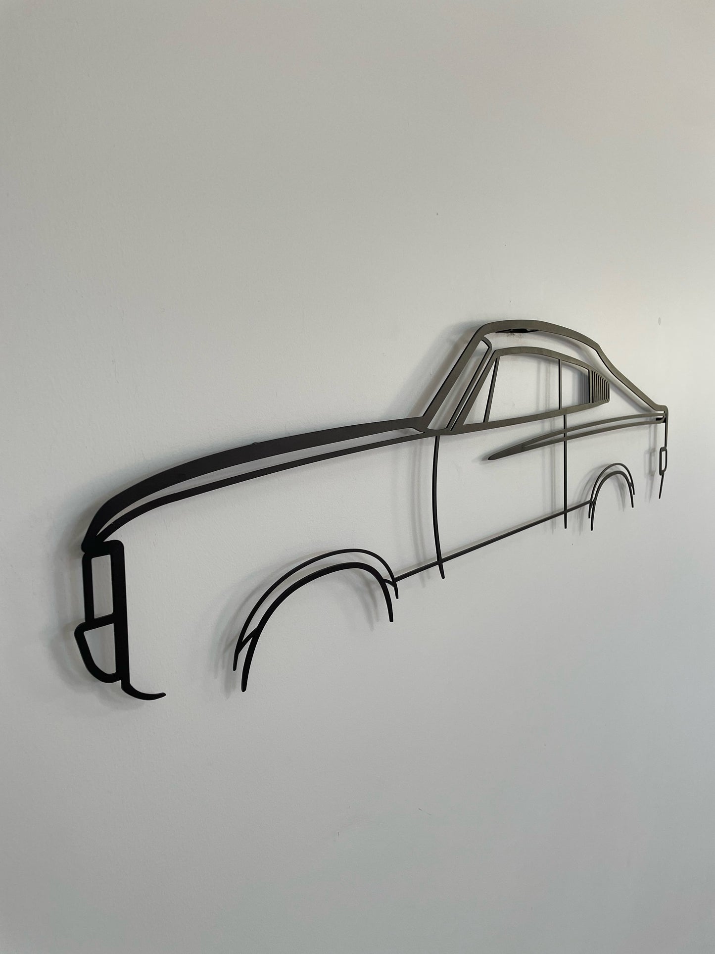 Side-on image of a Chrysler Charger silhouette wall art piece. 