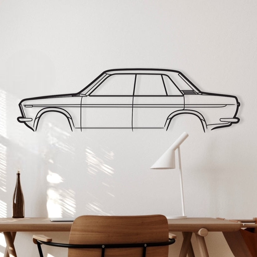 A metal wall art in the shape of a Datsun 1600 4 Door car silhouette, displayed above a desk in a room with wooden flooring.