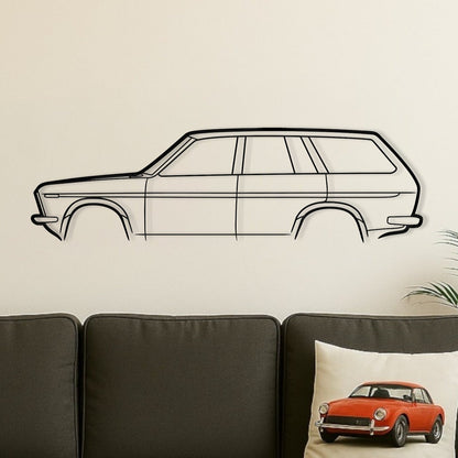 Living room with a gray sofa, wooden coffee table, and wall decal of a car.