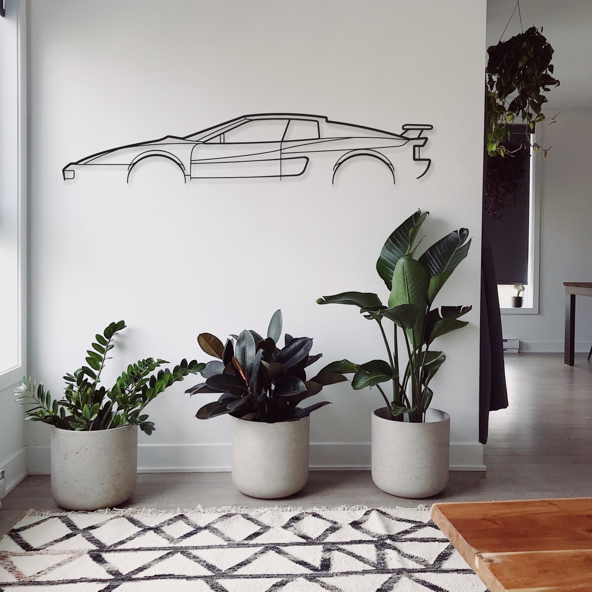 The Ferrari Testarossa wall art piece hanging in a lounge room. 