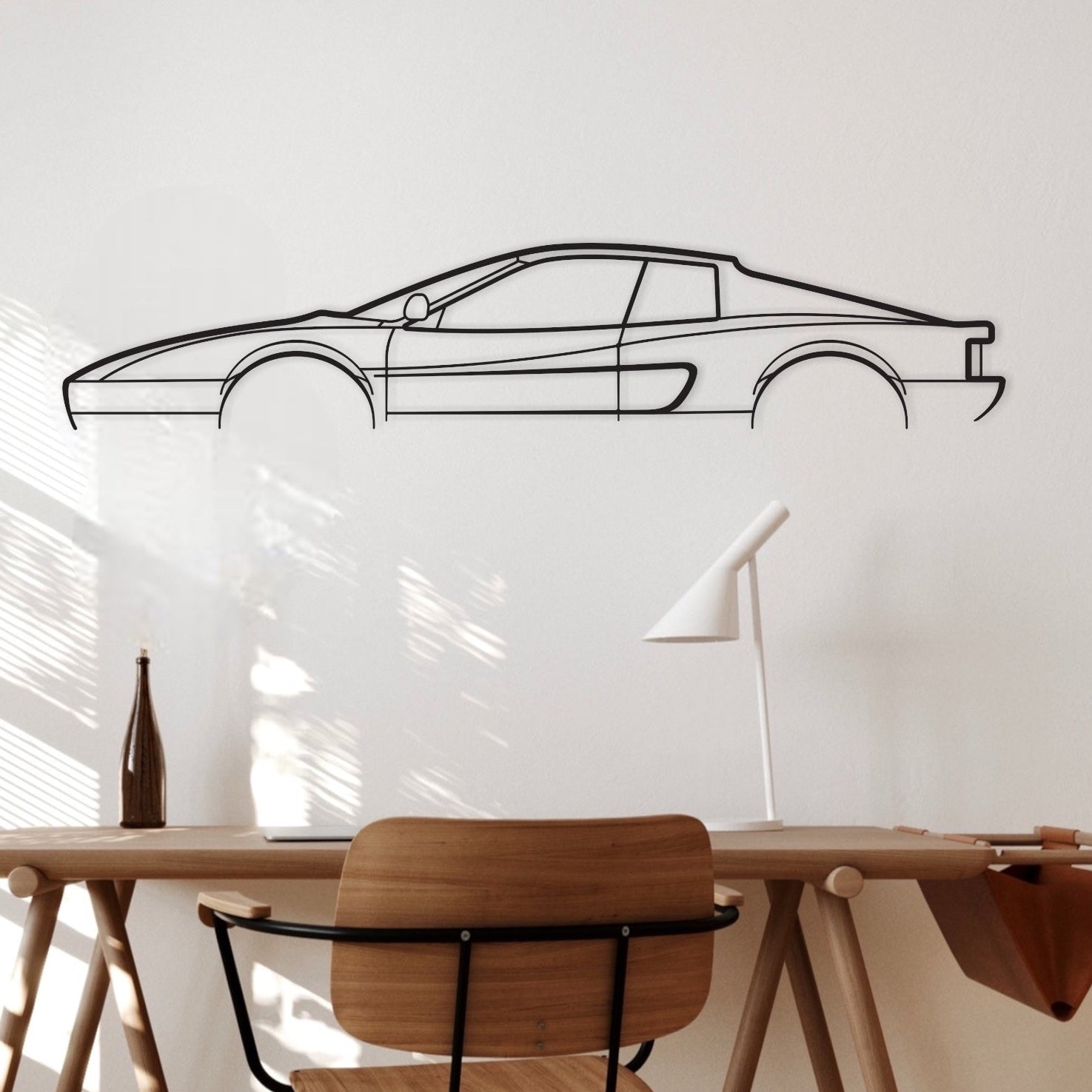 Ferrari Testerossa car decor hanging above an office desk. 