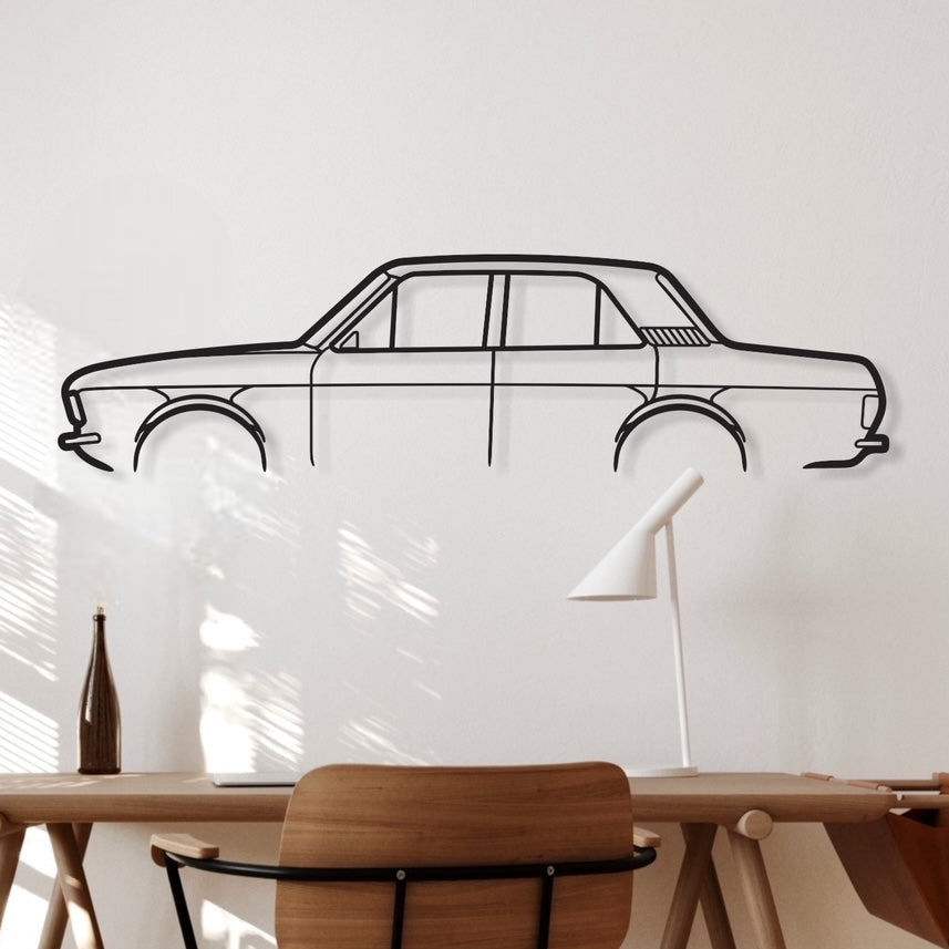 A metal wall art depicting the silhouette of a Ford Cortina MK2 4Door car, displayed on a wall above a wooden desk with a chair and lamp in a room with natural lighting.