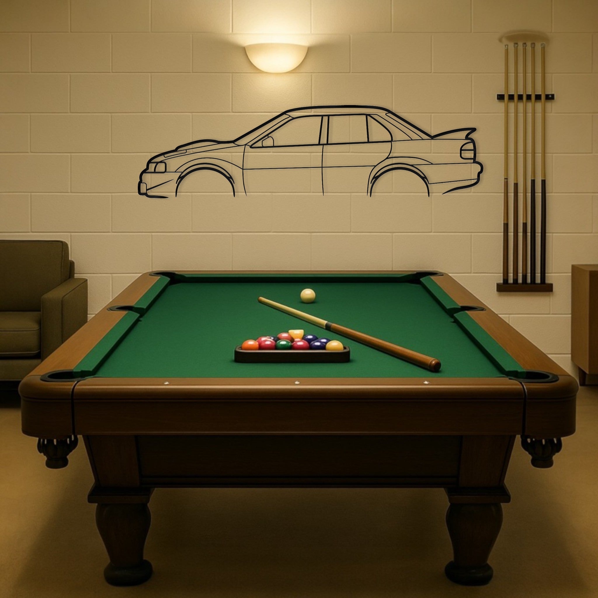 Pool table with billiard balls and cues against a wall with a car drawing.