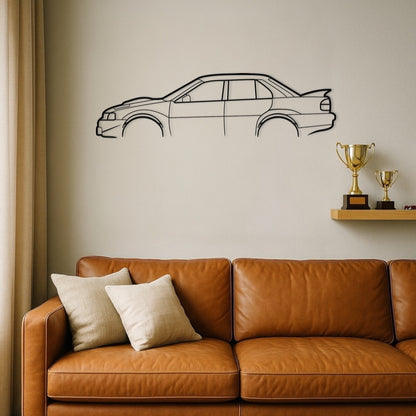 Brown leather sofa with decorative pillows against a wall with a car outline and trophies.