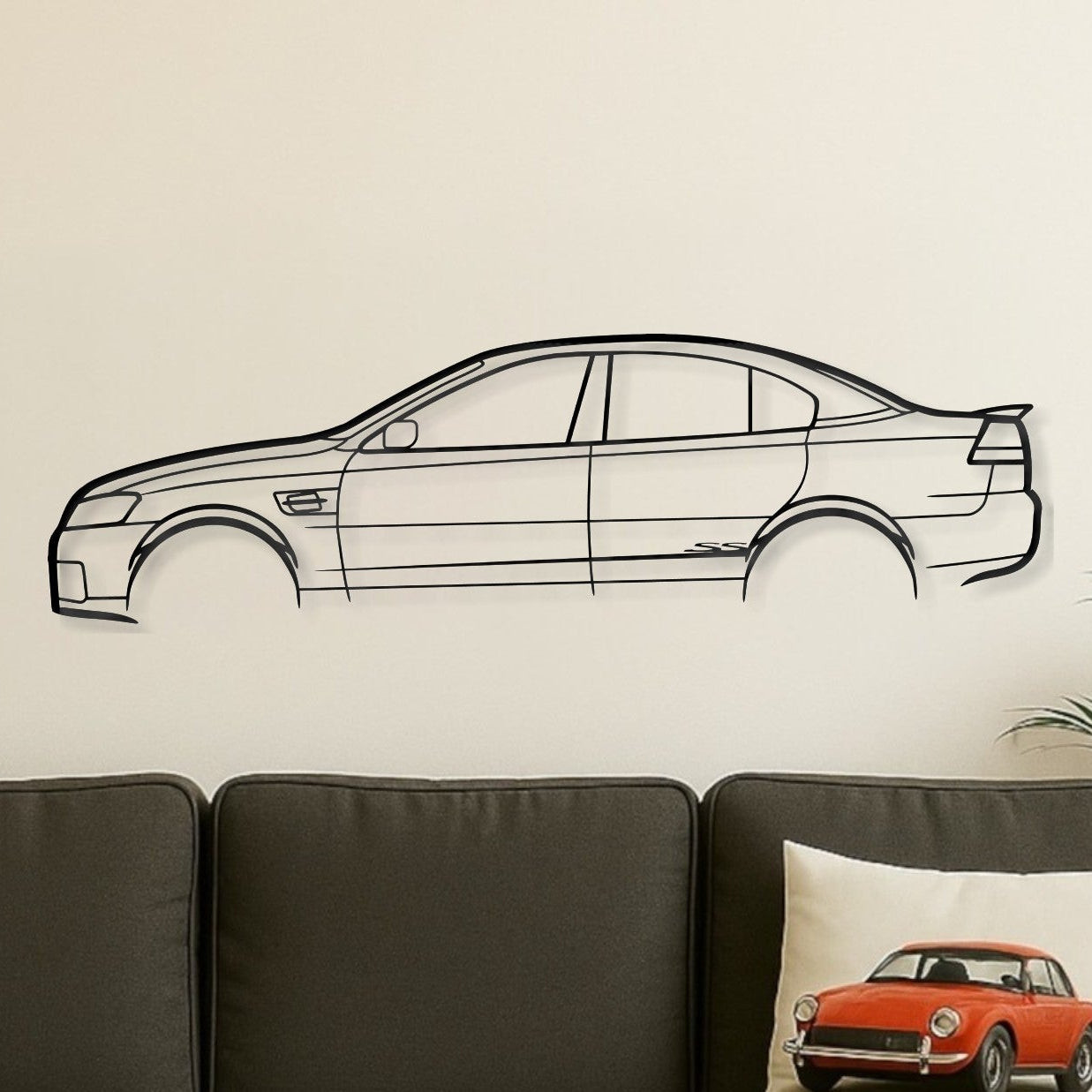Living room with a gray sofa, wooden coffee table, and car-themed decor.