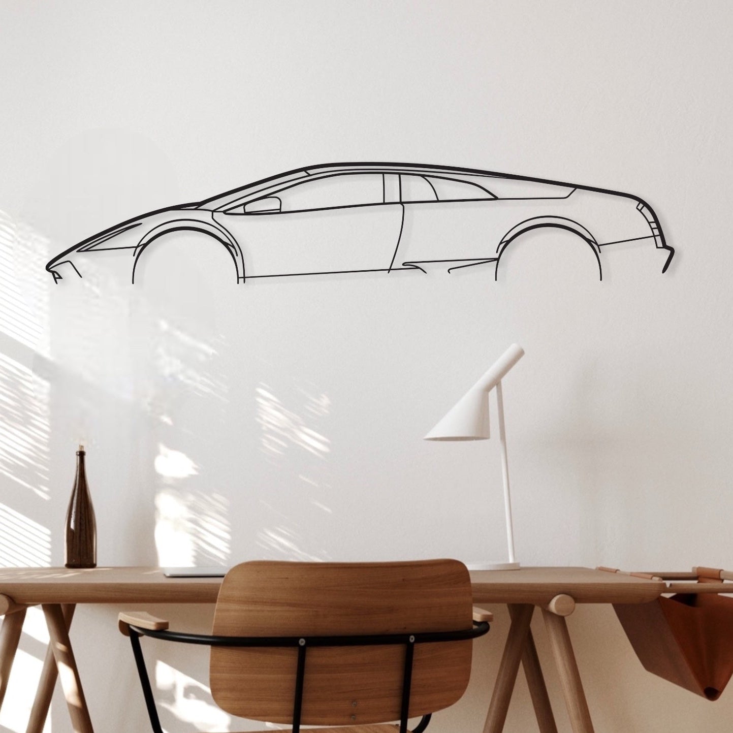 Lamborghini Mercilago car silhouette wall art hangs in an office. 