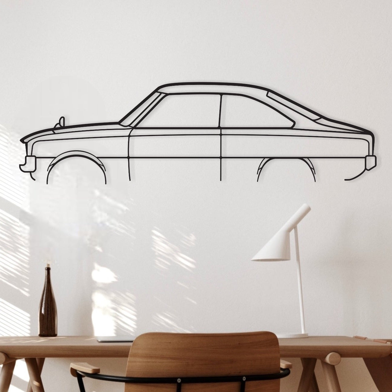 Mazda R100 Half REAR ARCH black metal silhouette hanging in an office.