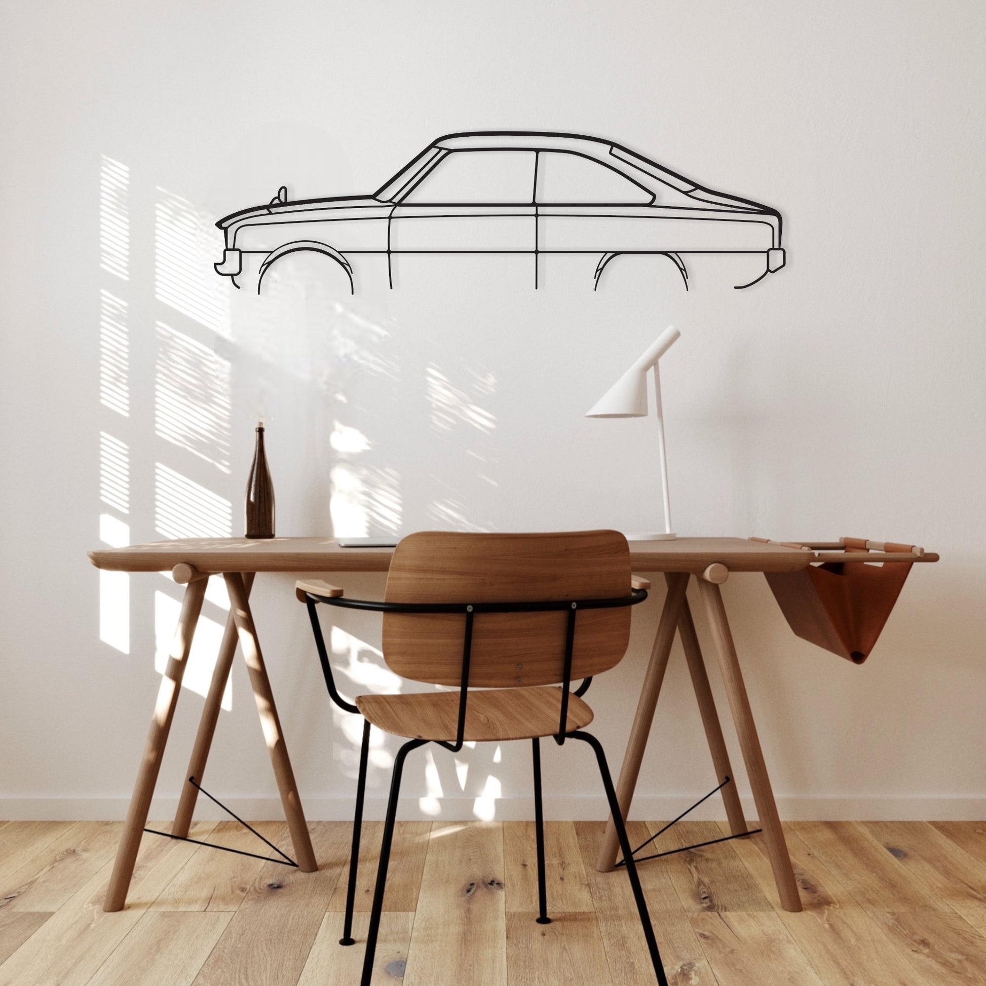 Mazda R100 Half REAR ARCH black metal silhouette hanging in an office.