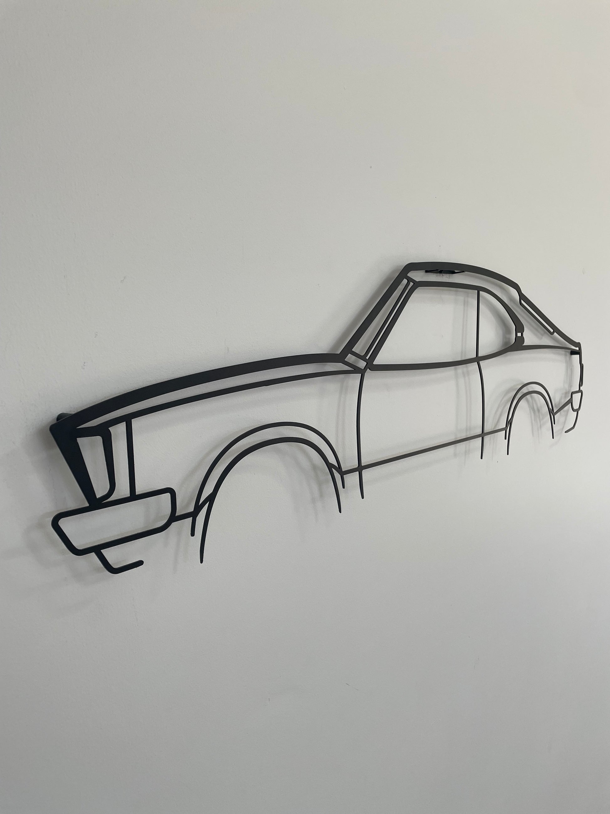 Mazda RX3 2 Door large car wall decor side-on against a white wall. 