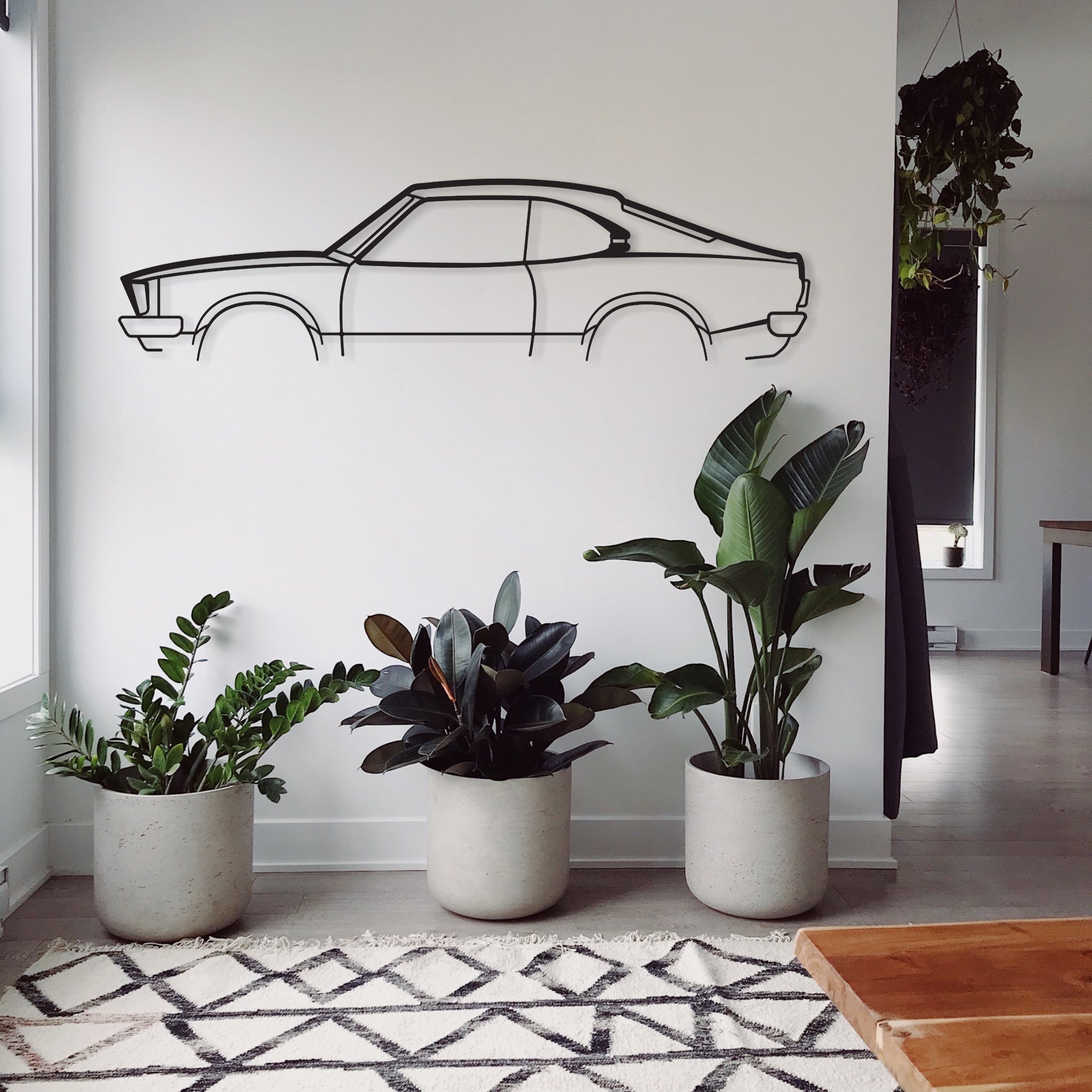 Mazda RX3 2 Door metal wall print in a living room.