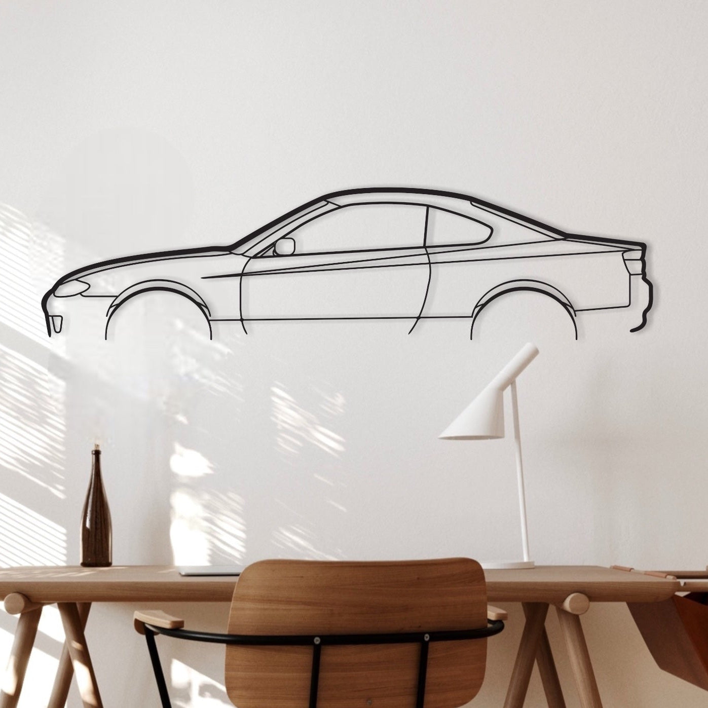 Nissan Silvia s15 car silhouette wall art hangs in an office. 