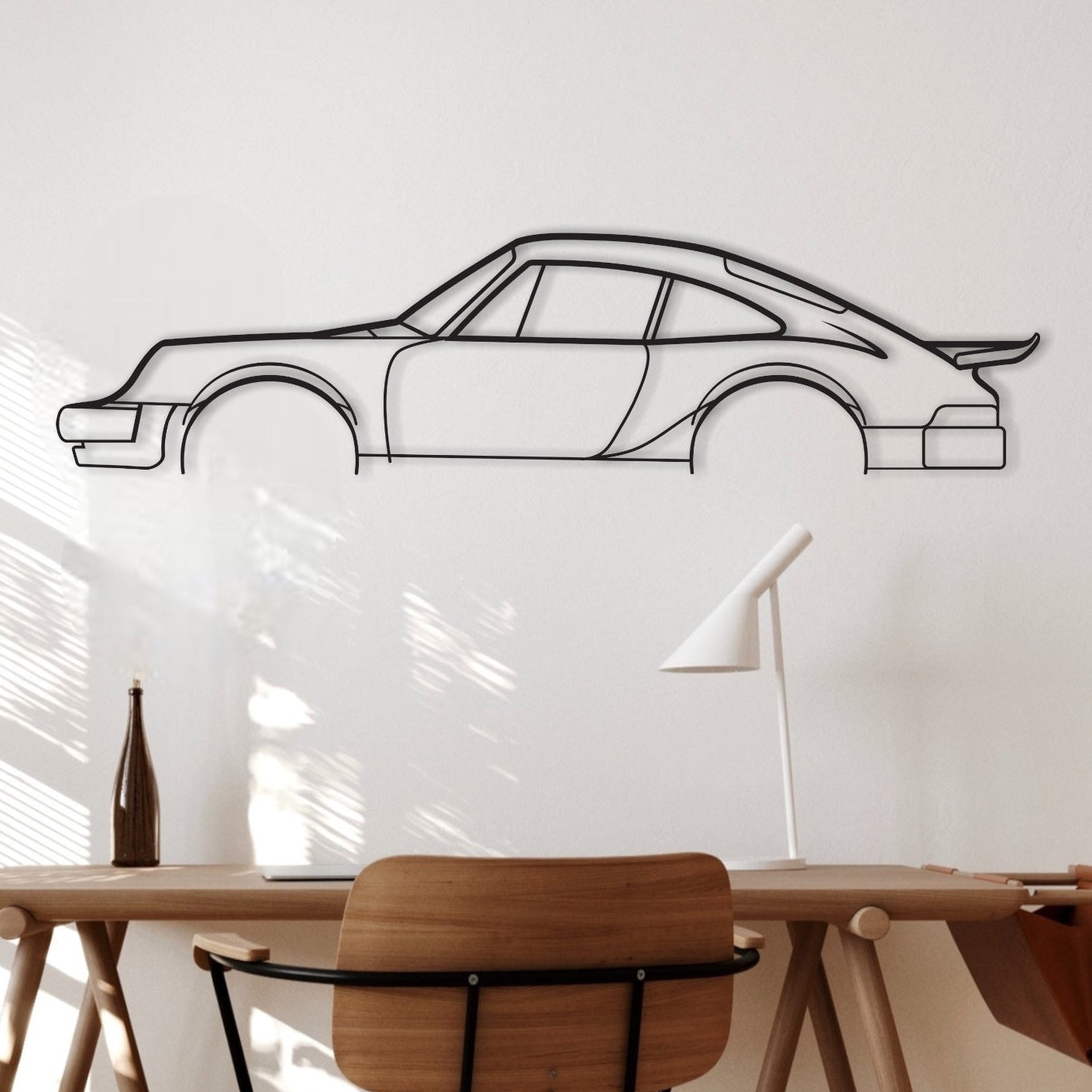Porsche 911 Turbo Flat Wing black metal silhouette hanging in an office.