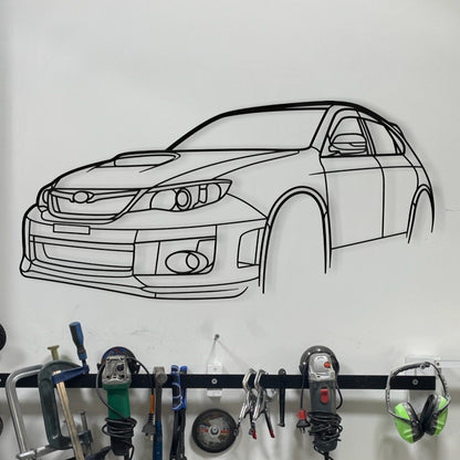 Subaru Impreza WRX STi Hatchback steel silhouette wall art displayed in a modern garage or man cave