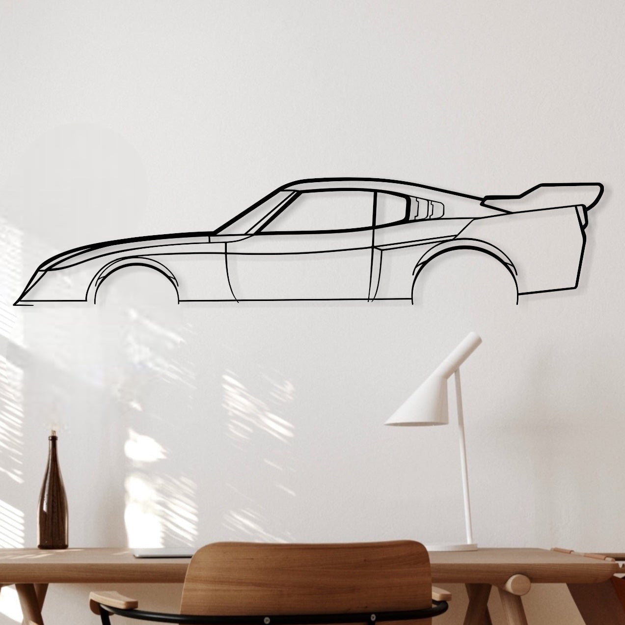 Toyota Celica LB black metal silhouette hanging in an office.