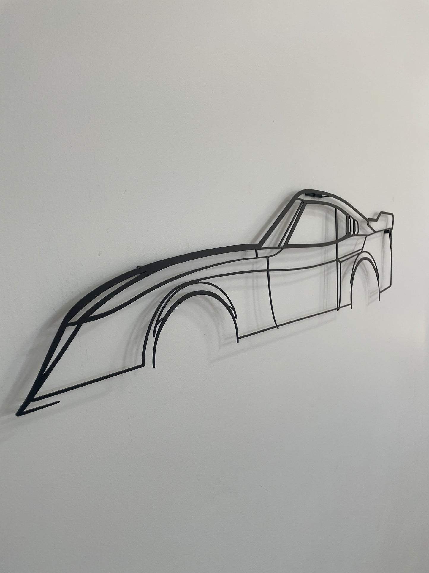 Side on view of the Toyota Celica LB metal silhouette wall hanging. 