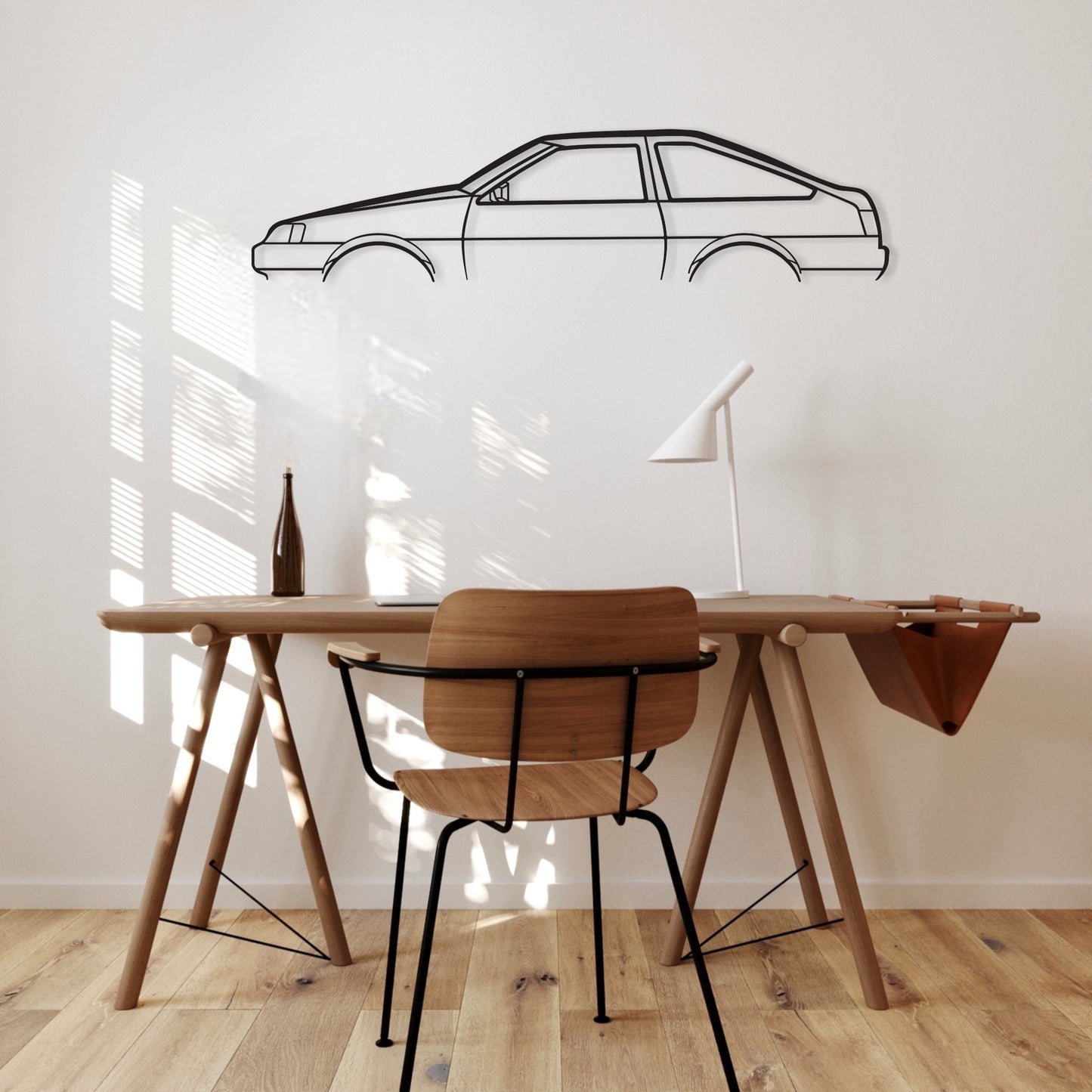 Toyota Corolla Sprinter Levin AE86 car silhouette wall art hangs in an office. 