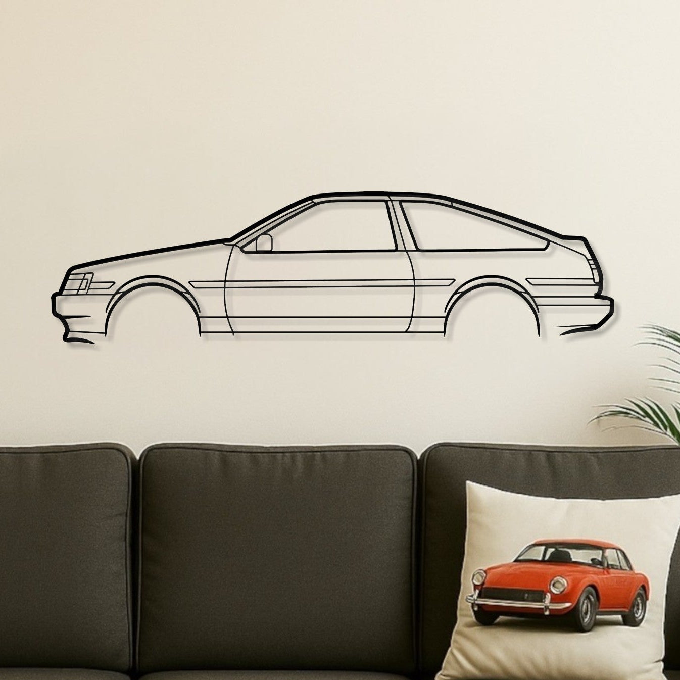 Living room with a gray sofa, wooden coffee table, and car-themed decor.