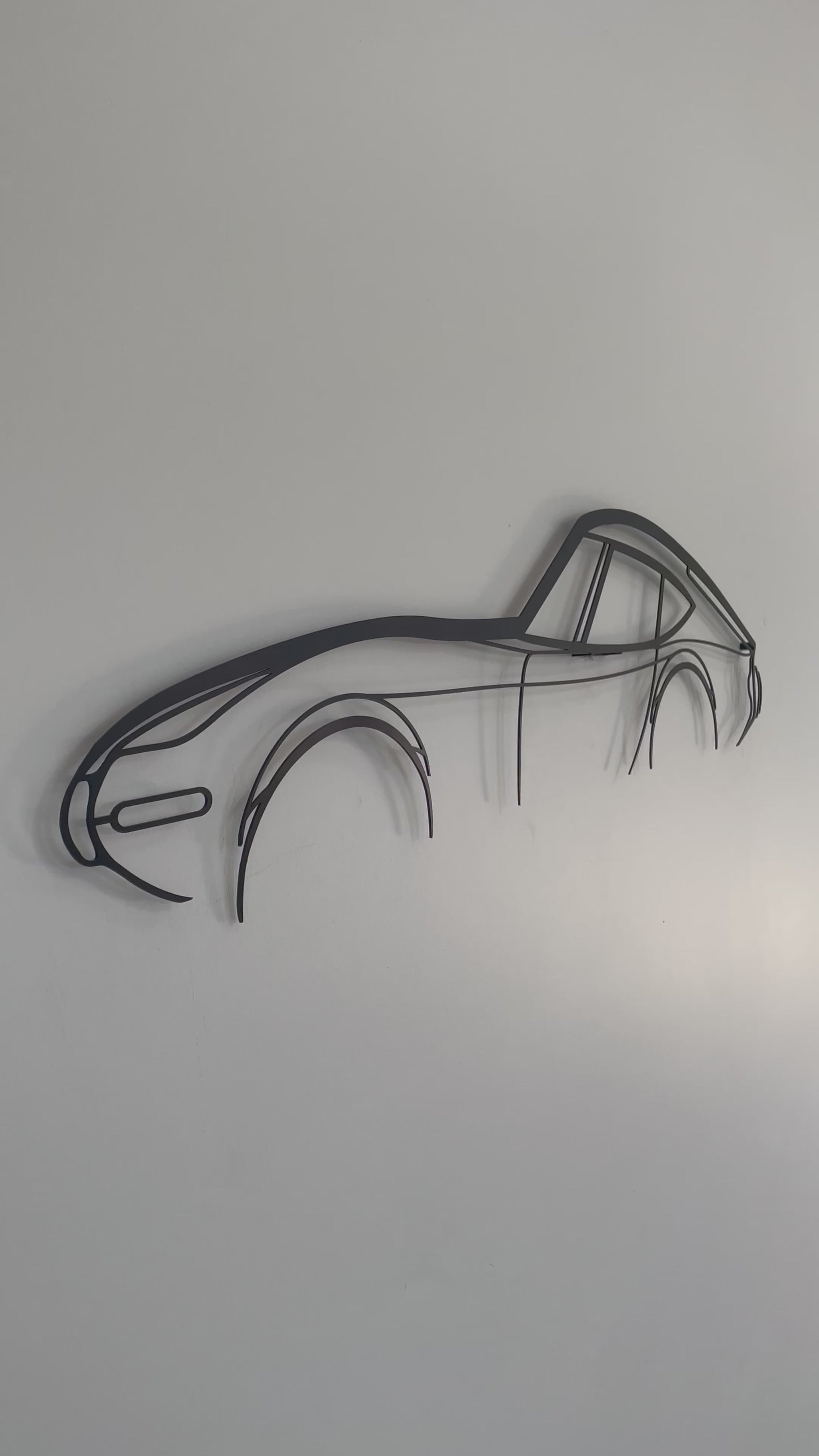 Close up and side on of Toyota GT 2000 car outline wall piece