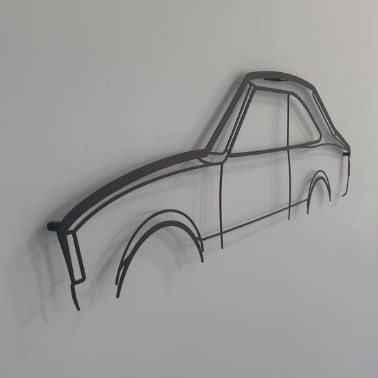 side on and close up of metal wall hanging Mazda RX2 Coupe 